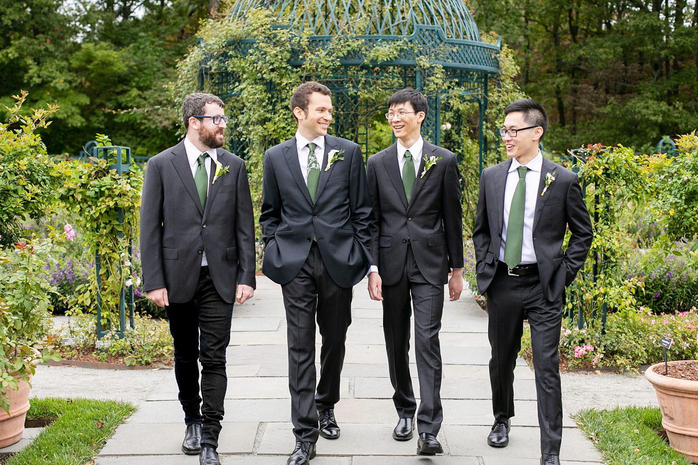 New York Botanical Garden wedding photos with groomsmen in dark gray suits, by Mikkel Paige Photography. After the couple's engagement photoshoot in Manhattan I was so excited for their fall wedding near the Conservatory at the Terrace Room, at this NYC venue. #mikkelpaige #nybg #newyorkbotanicalgardenwedding #NYBotanicalGarden #Bronxwedding #newyorkcityweddingvenues #groomstyle #weddingparty #groomsmen #bridalparty