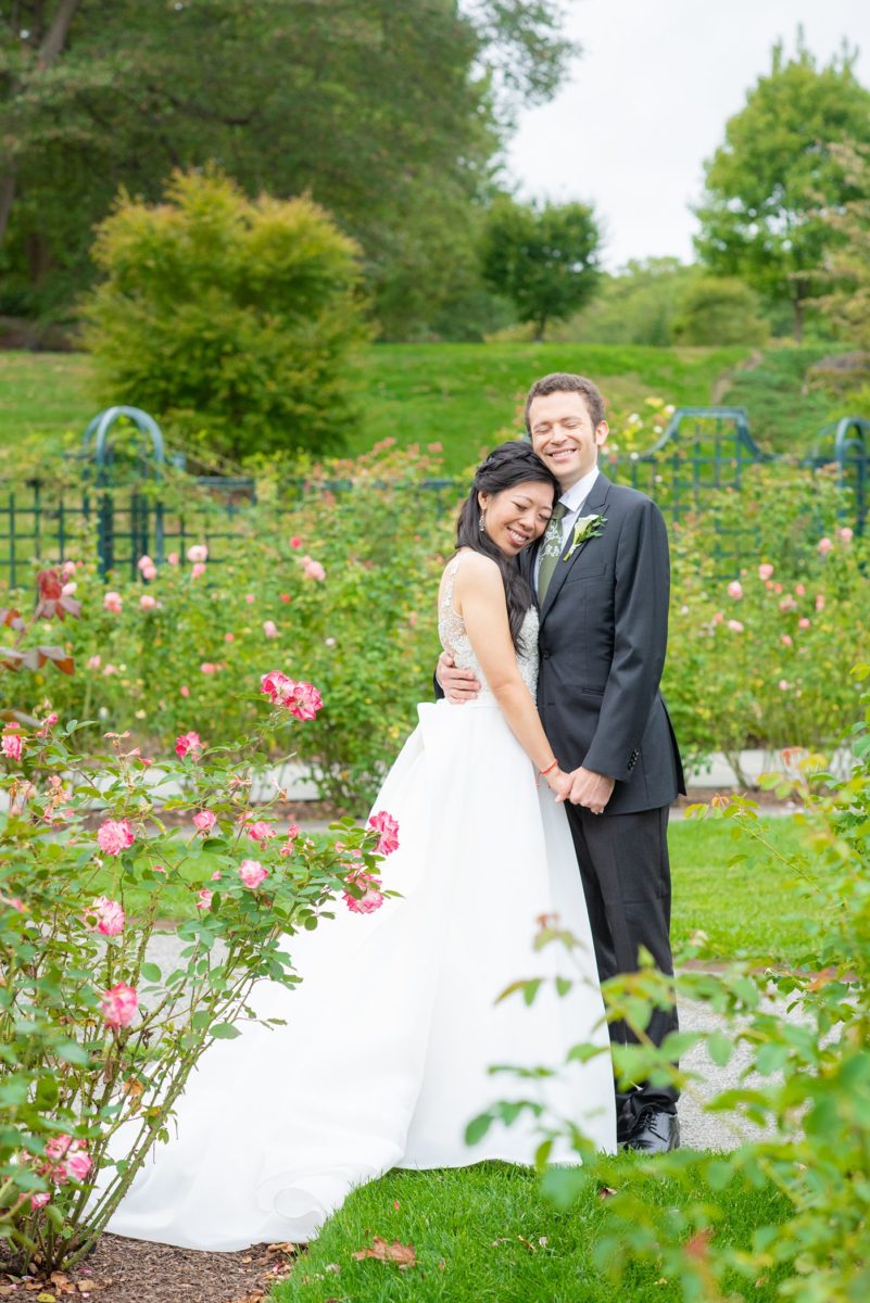 New York Botanical Garden wedding photos by Mikkel Paige Photography. The groom wore a green tie with floral detail and gray suit and bride a beaded ballgown with bow on the back. After the couple's engagement photoshoot in Manhattan I was so excited for their fall wedding near the Conservatory at the Terrace Room, at this NYC venue. #mikkelpaige #nybg #asianbride #bridestyle #brideandgroom #newyorkbotanicalgardenwedding #groomstyle #NYBotanicalGarden #Bronxwedding #newyorkcityweddingvenue