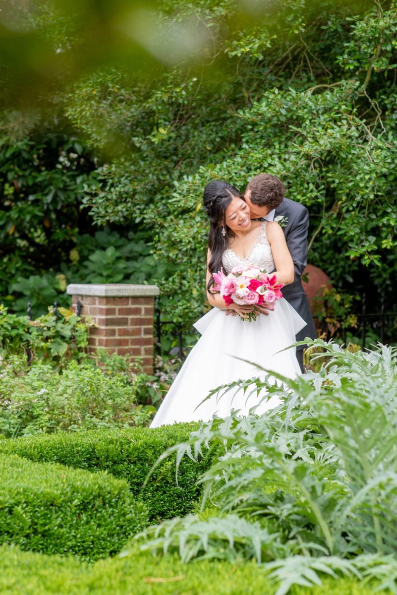 New York Botanical Garden wedding photos by Mikkel Paige Photography. The groom wore a green tie with floral detail and gray suit and bride a beaded ballgown with bow on the back. After the couple's engagement photoshoot in Manhattan I was so excited for their fall wedding near the Conservatory at the Terrace Room, at this NYC venue. #mikkelpaige #nybg #asianbride #bridestyle #brideandgroom #newyorkbotanicalgardenwedding #groomstyle #NYBotanicalGarden #Bronxwedding #newyorkcityweddingvenue