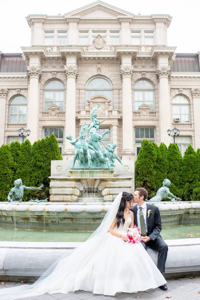 New York Botanical Garden wedding photos by Mikkel Paige Photography. The groom wore a green tie with floral detail and gray suit and bride a beaded ballgown with bow on the back. After the couple's engagement photoshoot in Manhattan I was so excited for their fall wedding near the Conservatory at the Terrace Room, at this NYC venue. #mikkelpaige #nybg #asianbride #bridestyle #brideandgroom #newyorkbotanicalgardenwedding #groomstyle #NYBotanicalGarden #Bronxwedding #newyorkcityweddingvenue