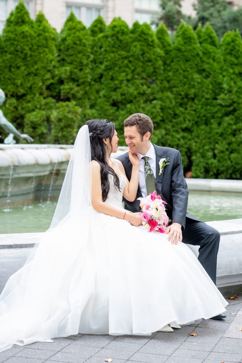 New York Botanical Garden wedding photos by Mikkel Paige Photography. The groom wore a green tie with floral detail and gray suit and bride a beaded ballgown with bow on the back. After the couple's engagement photoshoot in Manhattan I was so excited for their fall wedding near the Conservatory at the Terrace Room, at this NYC venue. #mikkelpaige #nybg #asianbride #bridestyle #brideandgroom #newyorkbotanicalgardenwedding #groomstyle #NYBotanicalGarden #Bronxwedding #newyorkcityweddingvenue