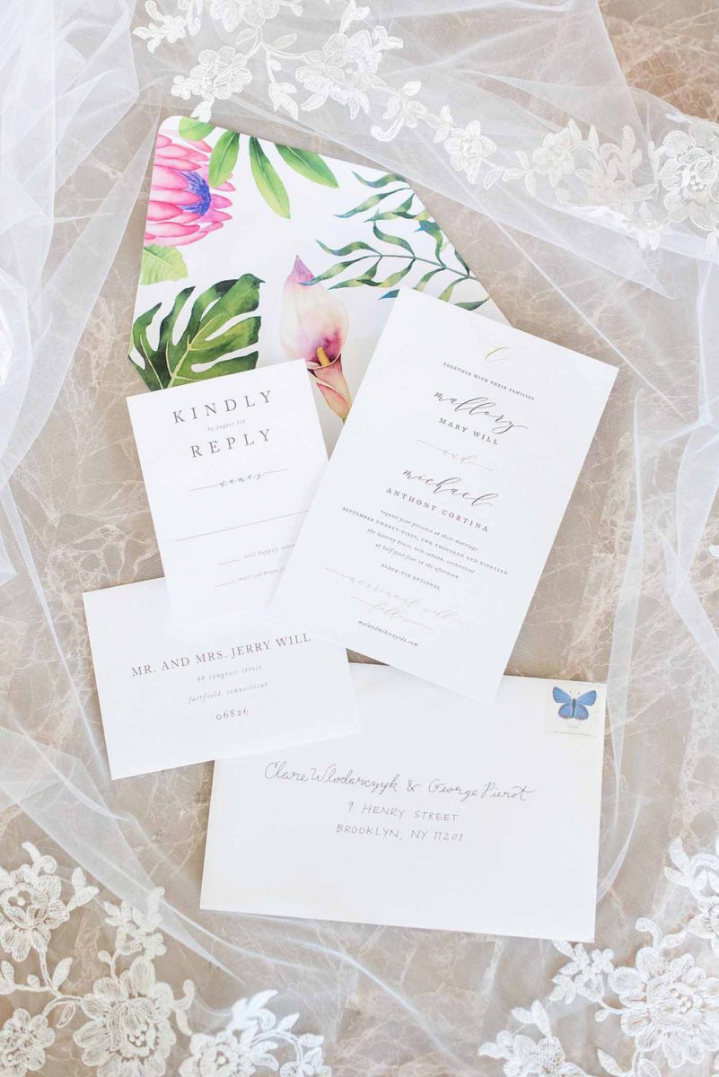 Photos by Mikkel Paige Photography at Waveny House wedding venue in New Canaan, Connecticut. This beautiful venue has an outdoor garden for the ceremony and indoor historic home for the reception. The bride and groom had an elegant, simple white invitation with script and colorful liner with King Protea and greenery. #mikkelpaige #wavenyhouse #wavenyhousewedding #connecticutweddingvenue #connecticutweddingphotographer #simpleweddinginvitation #whiteweddinginvitation