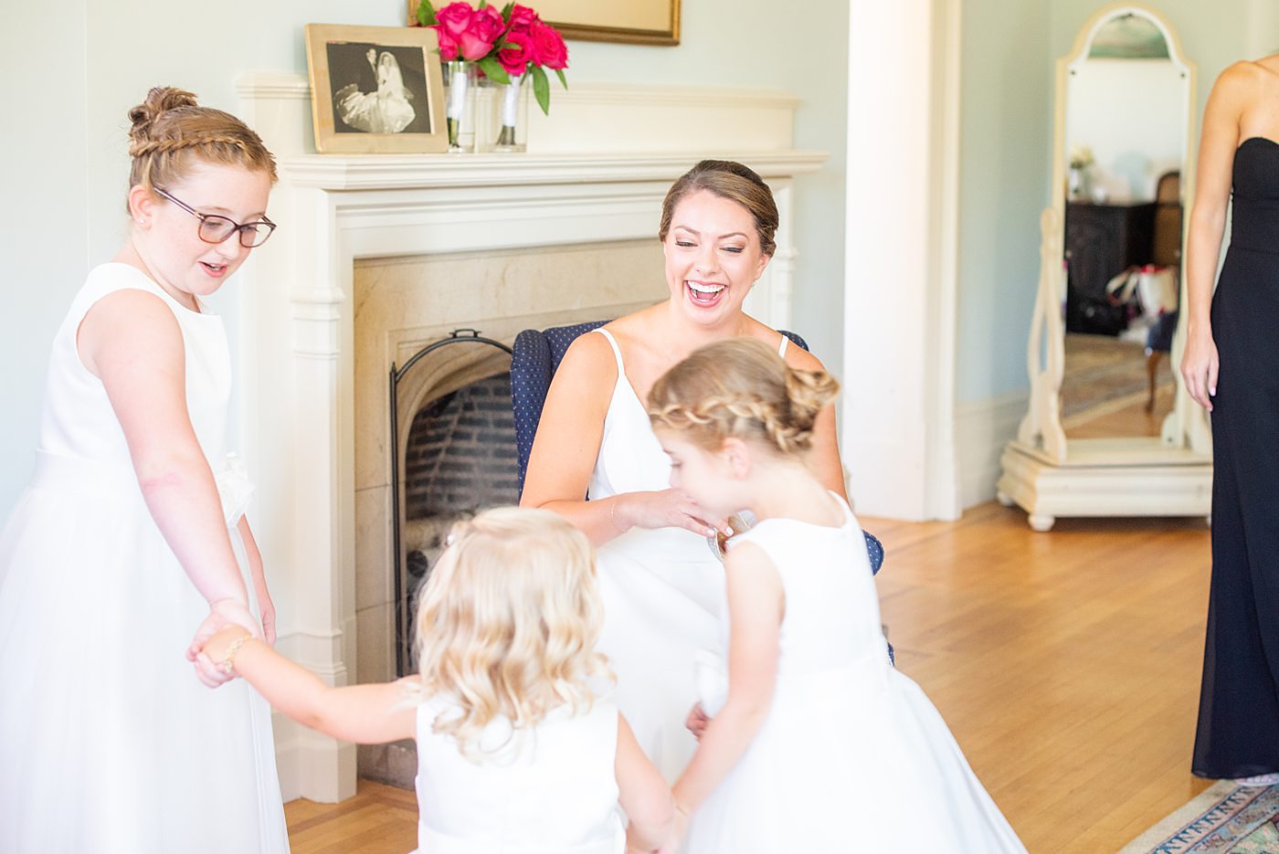 Photos by Mikkel Paige Photography at Waveny House wedding venue in New Canaan, Connecticut. This beautiful venue has an outdoor garden for the ceremony and indoor historic home for the reception. The bride got ready in the main house with her flower girls. #mikkelpaige #wavenyhouse #wavenyhousewedding #connecticutweddingvenue #connecticutweddingphotographer #gettingready #flowergirls