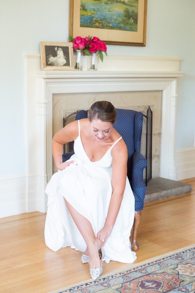 Photos by Mikkel Paige Photography at Waveny House wedding venue in New Canaan, Connecticut. This beautiful venue has an outdoor garden for the ceremony and indoor historic home for the reception. The bride and groom took photos on the park property, him in a tuxedo and her in a simple white gown with elaborate lace back. She carried an all white and ivory bouquet. #mikkelpaige #wavenyhouse #wavenyhousewedding #connecticutweddingvenue #connecticutweddingphotographer #brideandgroom #whitebouquet