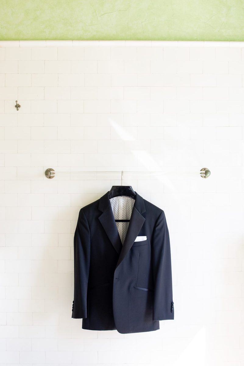 Detail photo of the groom's tuxedo jacket by Mikkel Paige Photography. The wedding was at the Waveny House in New Canaan, Connecticut. This beautiful venue has an outdoor garden for the ceremony and indoor historic home for the wedding reception. #mikkelpaige #wavenyhouse #wavenyhousewedding #connecticutweddingvenue #connecticutweddingphotographer #gettingready #groomstyle #tuxedo #detailshots