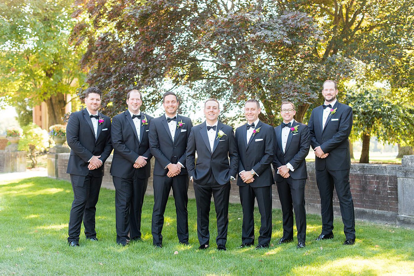 Photos by Mikkel Paige Photography at Waveny House wedding venue in New Canaan, Connecticut. This beautiful venue has an outdoor garden for the ceremony and indoor historic home for the reception. The groom and groomsmen wore black tuxedos with rose boutonnieres. #mikkelpaige #wavenyhouse #wavenyhousewedding #connecticutweddingvenue #connecticutweddingphotographer #weddingparty #groomsmen #blacktuxedos