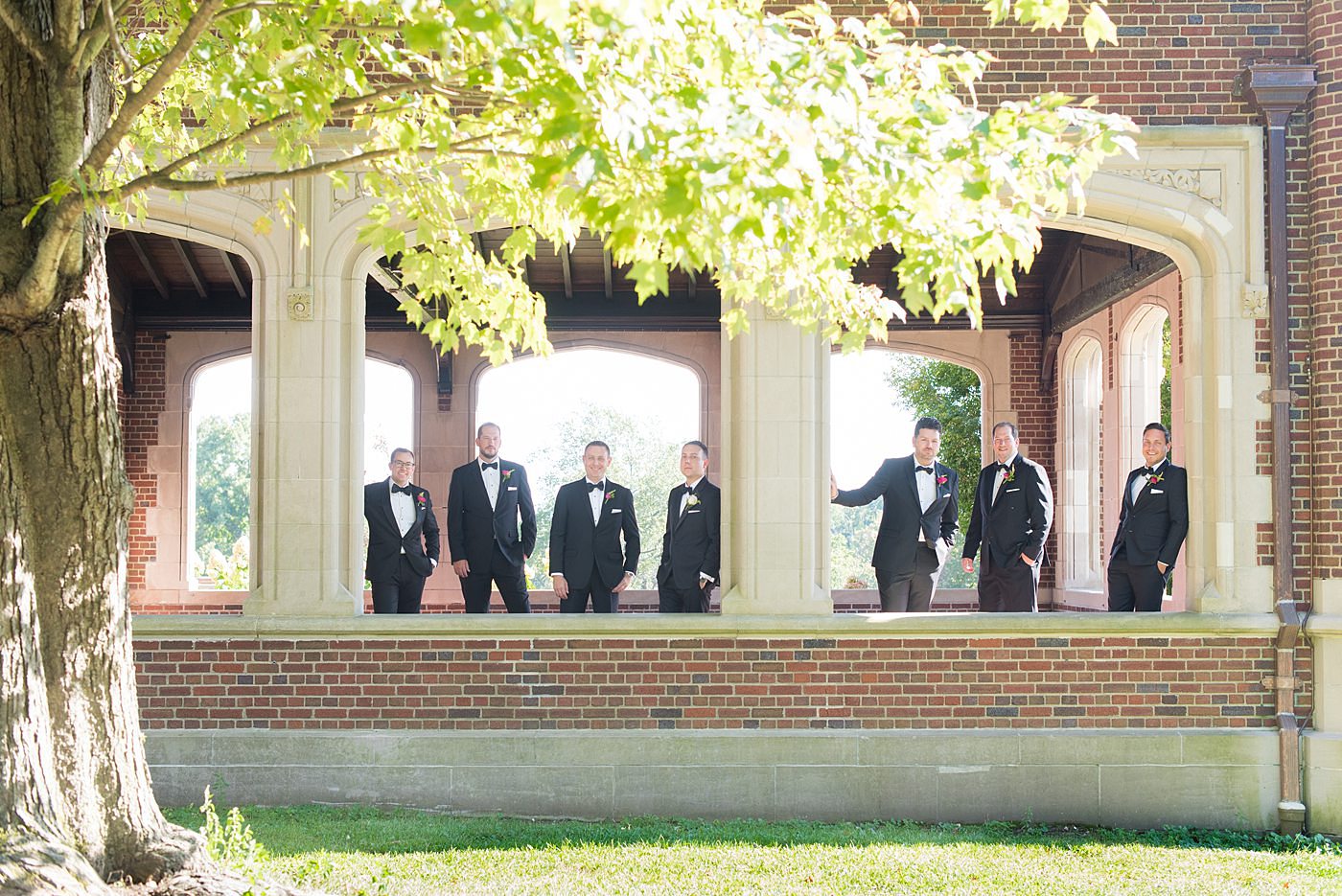 Photos by Mikkel Paige Photography at Waveny House wedding venue in New Canaan, Connecticut. This beautiful venue has an outdoor garden for the ceremony and indoor historic home for the reception. The groom and groomsmen wore black tuxedos with rose boutonnieres. #mikkelpaige #wavenyhouse #wavenyhousewedding #connecticutweddingvenue #connecticutweddingphotographer #weddingparty #groomsmen #blacktuxedos