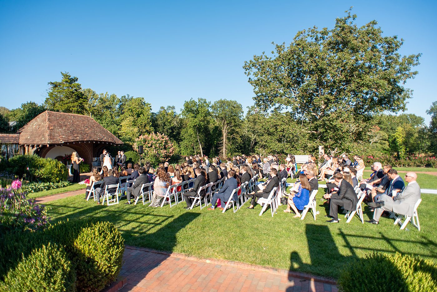 Photos by Mikkel Paige Photography at Waveny House wedding venue in New Canaan, Connecticut. This beautiful venue has an outdoor garden for the ceremony and indoor historic home for the reception. The bride and groom were married in a garden outside and had a bubble exit. #mikkelpaige #wavenyhouse #wavenyhousewedding #connecticutweddingvenue #connecticutweddingphotographer #outdoorceremony #gardenceremony #bubbleexit