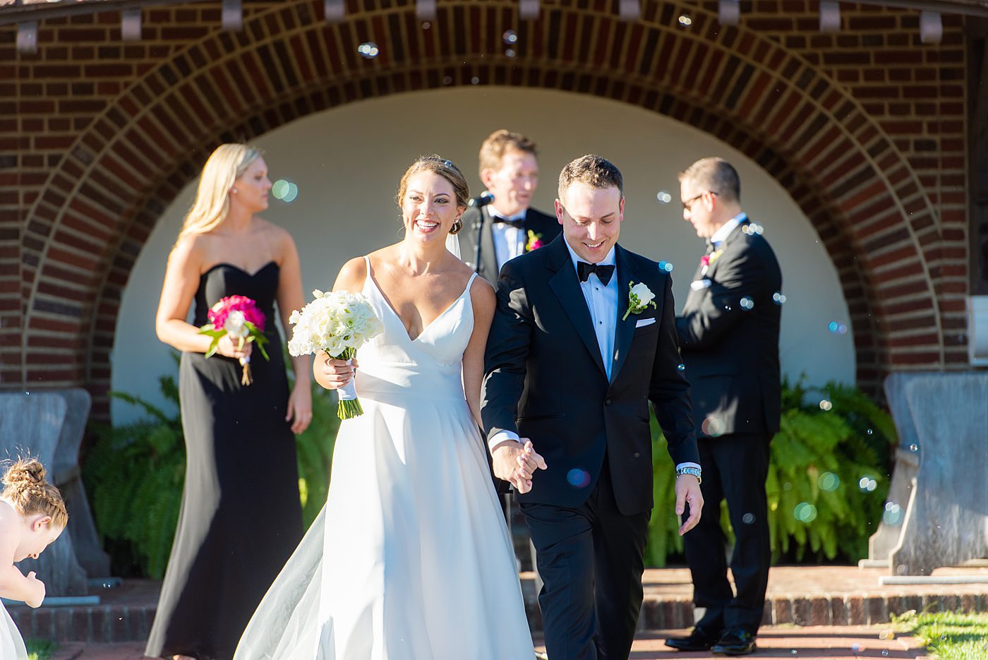 Photos by Mikkel Paige Photography at Waveny House wedding venue in New Canaan, Connecticut. This beautiful venue has an outdoor garden for the ceremony and indoor historic home for the reception. The bride and groom were married in a garden outside and had a bubble exit. #mikkelpaige #wavenyhouse #wavenyhousewedding #connecticutweddingvenue #connecticutweddingphotographer #outdoorceremony #gardenceremony #bubbleexit