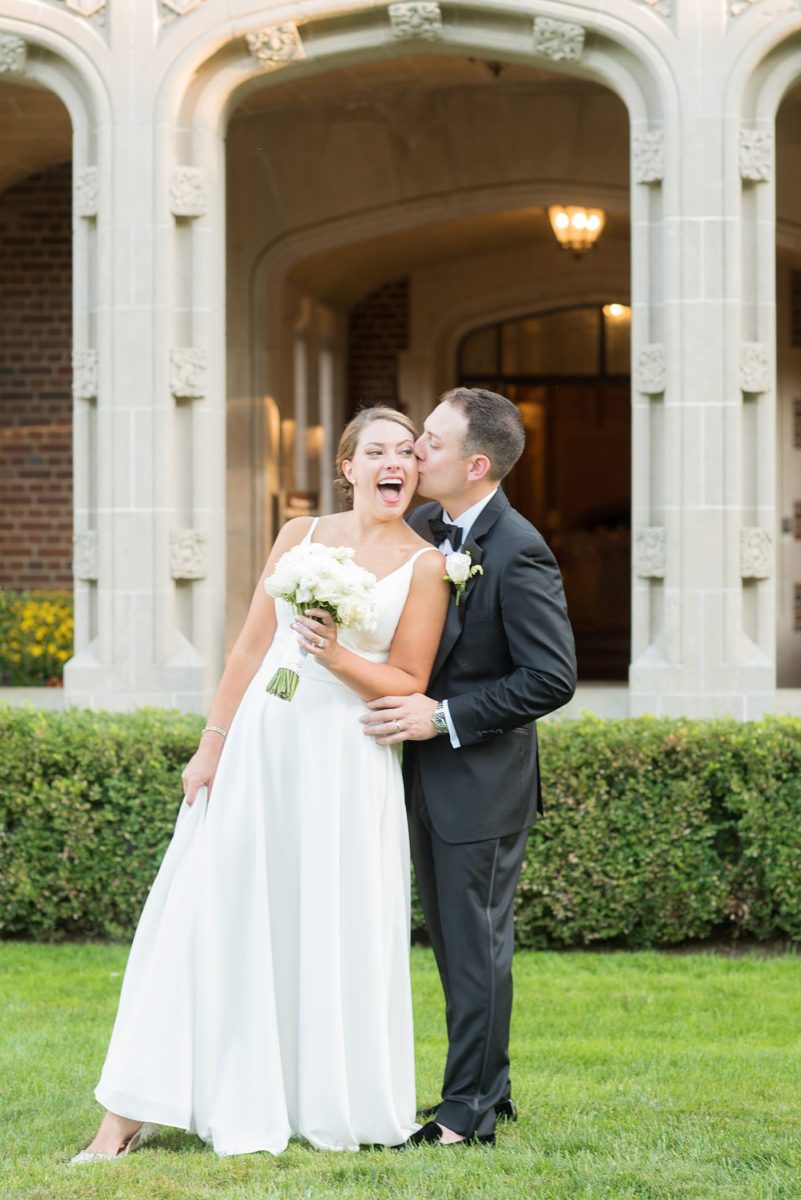 Photos by Mikkel Paige Photography at Waveny House wedding venue in New Canaan, Connecticut. This beautiful venue has an outdoor garden for the ceremony and indoor historic home for the reception. The bride and groom took photos on the park property, him in a tuxedo and her in a simple white gown with elaborate lace back. She carried an all white and ivory bouquet. #mikkelpaige #wavenyhouse #wavenyhousewedding #connecticutweddingvenue #connecticutweddingphotographer #brideandgroom #whitebouquet