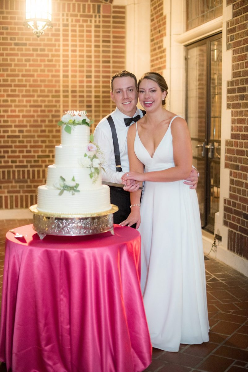 Waveny House wedding venue in New Canaan, Connecticut. Photos by Mikkel Paige Photography. This beautiful venue has an outdoor garden for the ceremony and indoor historic home for the reception. The bride and groom cut their three tier white buttercream wedding cake on the outside patio. #mikkelpaige #wavenyhouse #wavenyhousewedding #connecticutweddingvenue #connecticutweddingphotographer #weddingcake #cakecutting