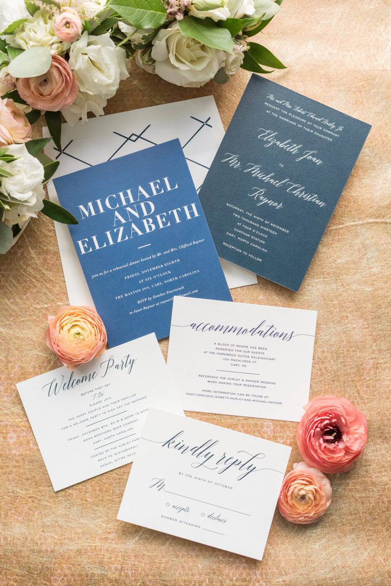 Detail photo of blue and white elegant stationery for a wedding at Chatham Station by Mikkel Paige Photography. This beautiful Cary, North Carolina venue has indoor and outdoor spaces. #mikkelpaige #RaleighWeddingPhotographer #NorthCarolinaWeddings #SouthernWeddings #weddinginvitation #weddingstationery #bluewedding #navyblue