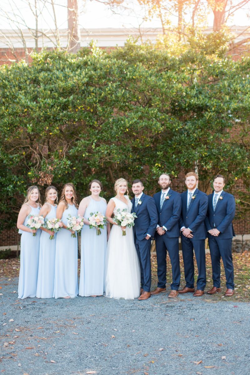 Chatham Station wedding photos by Mikkel Paige Photography from this urban chic beautiful venue in Cary, North Carolina. The bride wore a white tulle v-neck gown, bridesmaids in baby blue gowns and groom and groomsmen in blue suits with custom details for a fall celebration. #mikkelpaige #RaleighWeddingPhotographer #NorthCarolinaWeddings #SouthernWeddings #bridestyle #brideandgroom #bridalparty #lightbluegowns #bluebridesmaids #babybluewedding #lightbluewedding