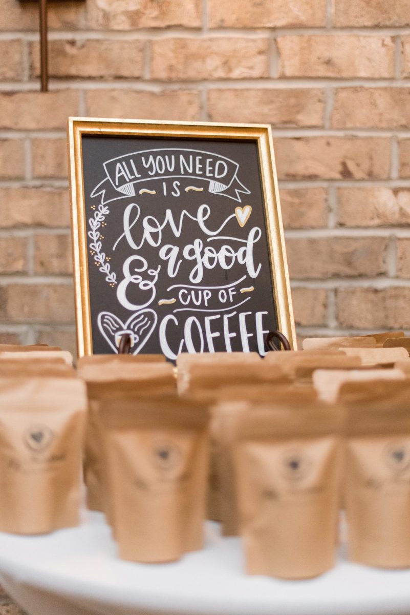 Custom coffee bar photos at Cary, North Carolina wedding venue Chatham Station by Mikkel Paige Photography. This urban, beautiful space has an indoor and outdoor space near Raleigh. The bride and groom love coffee and had the "perfect blend" cup sleeves and favors for guests with a unique hand-lettered sign. #mikkelpaige #RaleighWeddingPhotographer #NorthCarolinaWeddings #SouthernWeddings #fallwedding #RaleighWedding #CaryNorthCarolina #coffee #weddingfavors