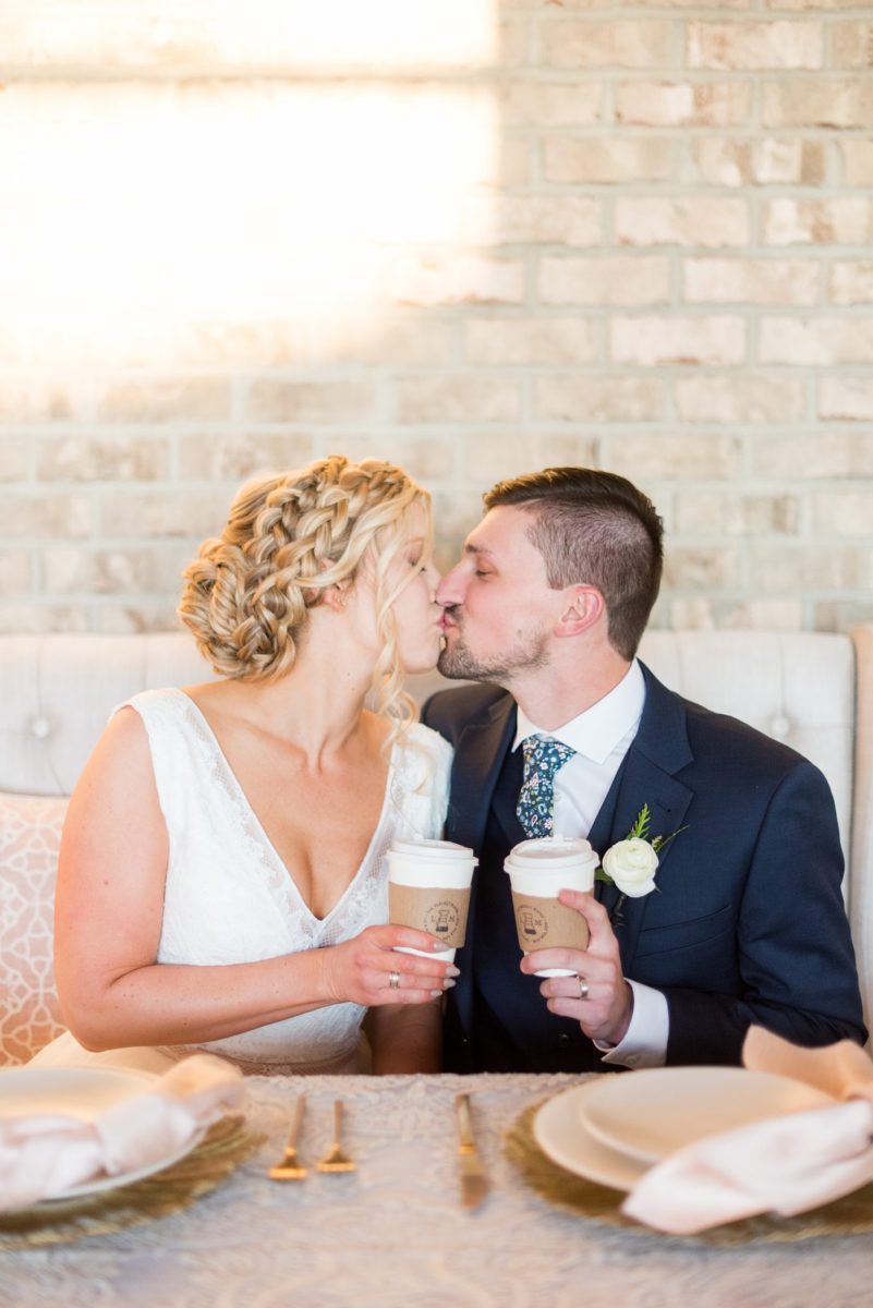 Custom coffee bar photos at Cary, North Carolina wedding venue Chatham Station by Mikkel Paige Photography. This urban, beautiful space has an indoor and outdoor space near Raleigh. The bride and groom love coffee and had the "perfect blend" cup sleeves and favors for guests with a unique hand-lettered sign. #mikkelpaige #RaleighWeddingPhotographer #NorthCarolinaWeddings #SouthernWeddings #fallwedding #RaleighWedding #CaryNorthCarolina #coffee #weddingfavors