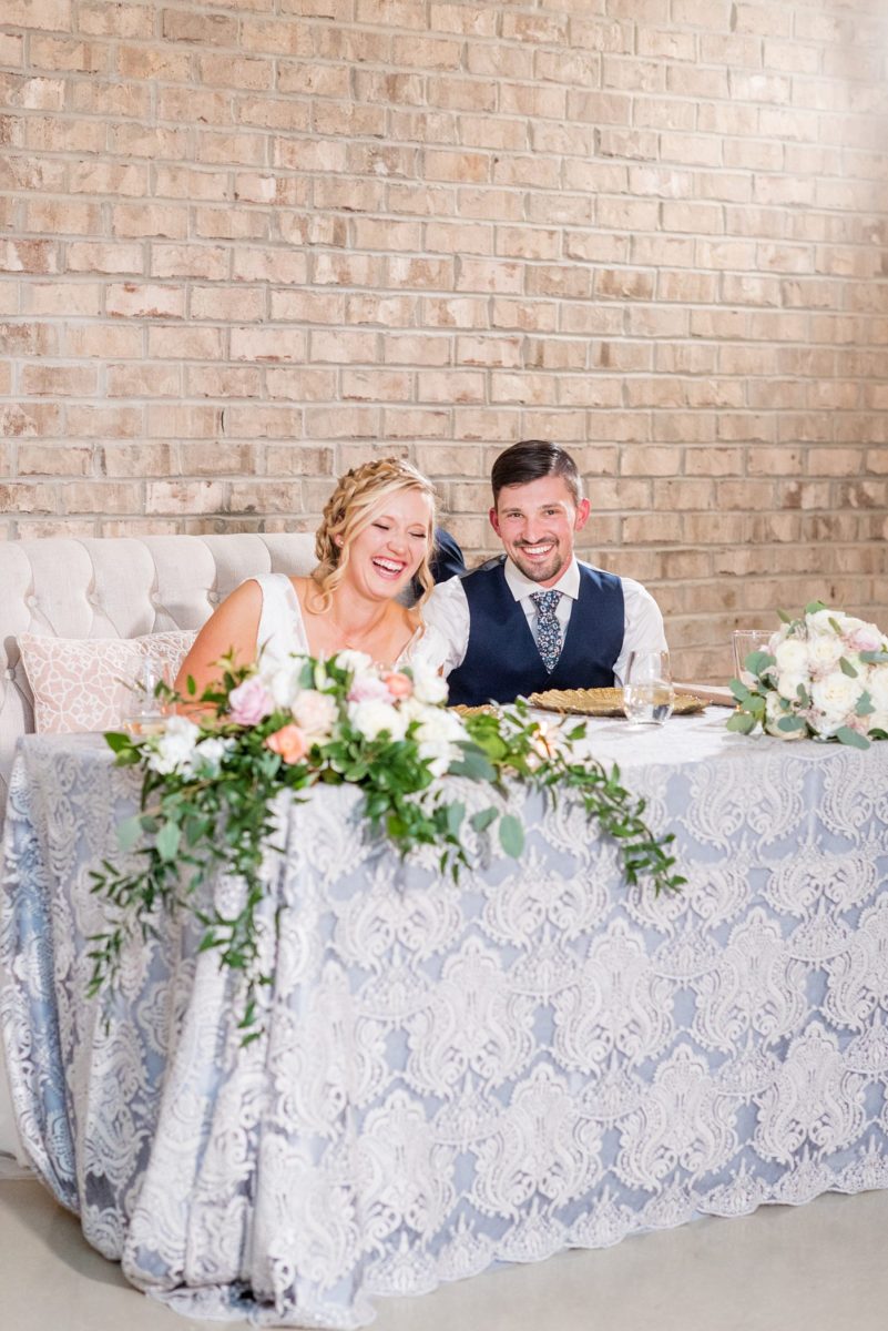 Fall photos at Cary, North Carolina wedding venue Chatham Station by Mikkel Paige Photography. This urban, beautiful space has an indoor and outdoor space near Raleigh. A DJ played as guests looked on during their reception. #mikkelpaige #RaleighWeddingPhotographer #NorthCarolinaWeddings #SouthernWeddings #fallwedding #RaleighWedding #CaryNorthCarolina