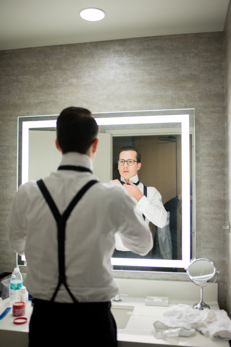 Wedding photographer Mikkel Paige Photography captures a ceremony at Duke Chapel and reception at The Rickhouse, a beautiful downtown venue in Durham, North Carolina. The bride and groom got ready at the JB Duke Hotel. Photo #durhamweddingphotographer #DukeChapelWedding #DurhamWeddingNorthCarolina #DurhamWeddingPhotographer #MikkelPaige #groomstyle #gettingready