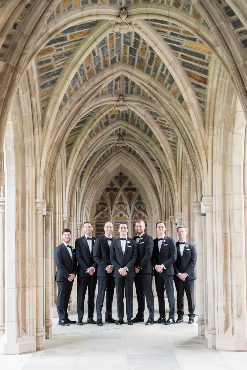 Wedding photographer Mikkel Paige Photography captures a ceremony at Duke Chapel and reception at The Rickhouse, a beautiful downtown venue in Durham, North Carolina. The groom and groomsmen wore classic black tuxedos. #durhamweddingphotographer #DukeChapelWedding #DurhamWeddingNorthCarolina #DurhamWeddingPhotographer #MikkelPaige #groomstyle #groomsmen