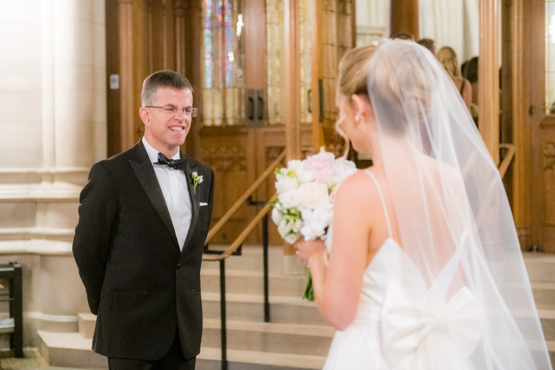 Wedding photographer Mikkel Paige Photography captures a ceremony at Duke Chapel and reception at The Rickhouse, a beautiful downtown venue in Durham, North Carolina. The father of the bride walked his daughter down the aisle at the iconic chapel, reminiscent of a European gothic church. #durhamweddingphotographer #DukeChapelWedding #DurhamWeddingNorthCarolina #DurhamWeddingPhotographer #MikkelPaige #weddingceremony #FatheroftheBride