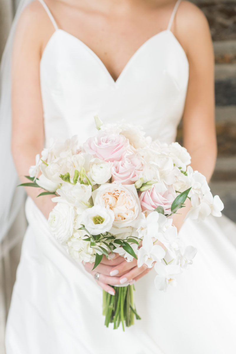 Wedding photographer Mikkel Paige Photography captures a ceremony at Duke Chapel and reception at The Rickhouse, a beautiful downtown venue in Durham, North Carolina. Detail photo the bride's pink and white bouquet with silver dollar eucalyptus. #durhamweddingphotographer #DukeChapelWedding #DurhamWeddingNorthCarolina #DurhamWeddingPhotographer #MikkelPaige #bridalbouquet #rosebouquet