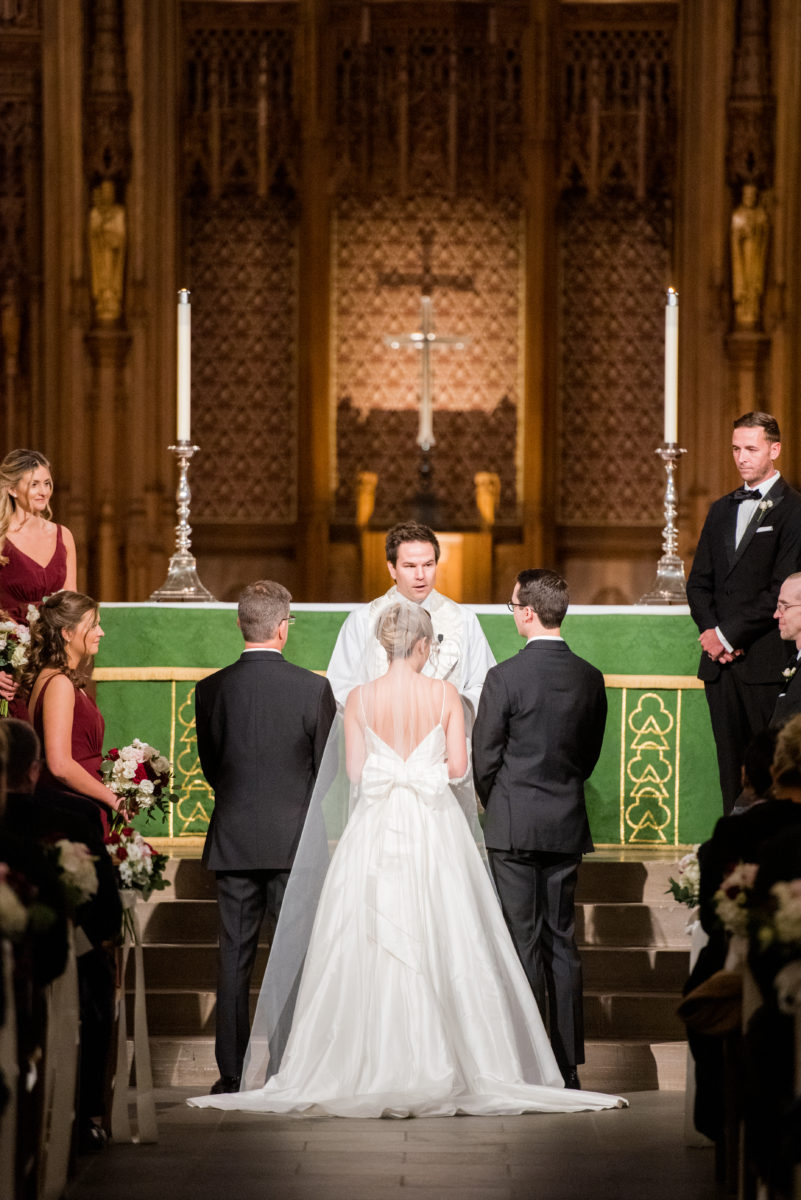 Wedding photographer Mikkel Paige Photography captures a ceremony at Duke Chapel and reception at The Rickhouse, a beautiful downtown venue in Durham, North Carolina. The bride and groom recited vows at the iconic chapel, reminiscent of a European gothic church. #durhamweddingphotographer #DukeChapelWedding #DurhamWeddingNorthCarolina #DurhamWeddingPhotographer #MikkelPaige #weddingceremony