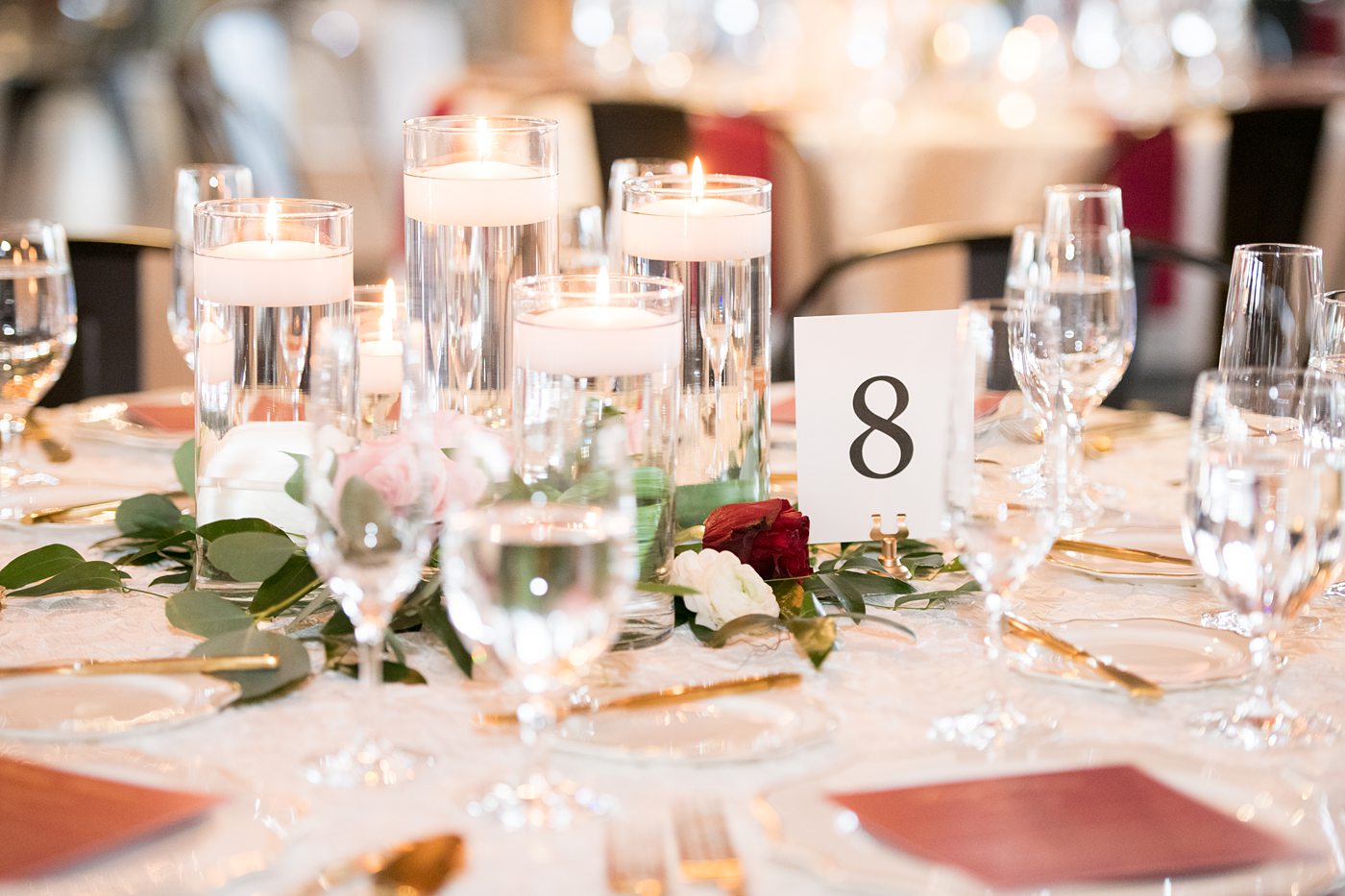 Wedding photographer Mikkel Paige Photography captures a ceremony at Duke Chapel and reception at The Rickhouse, a beautiful downtown Durham, North Carolina. The venue was filled with candlelight and greenery for a maroon and gold color palette wedding. #DukeChapelWedding #DurhamWeddingNorthCarolina #DurhamWeddingPhotographer #MikkelPaige #maroonwedding #fallwedding