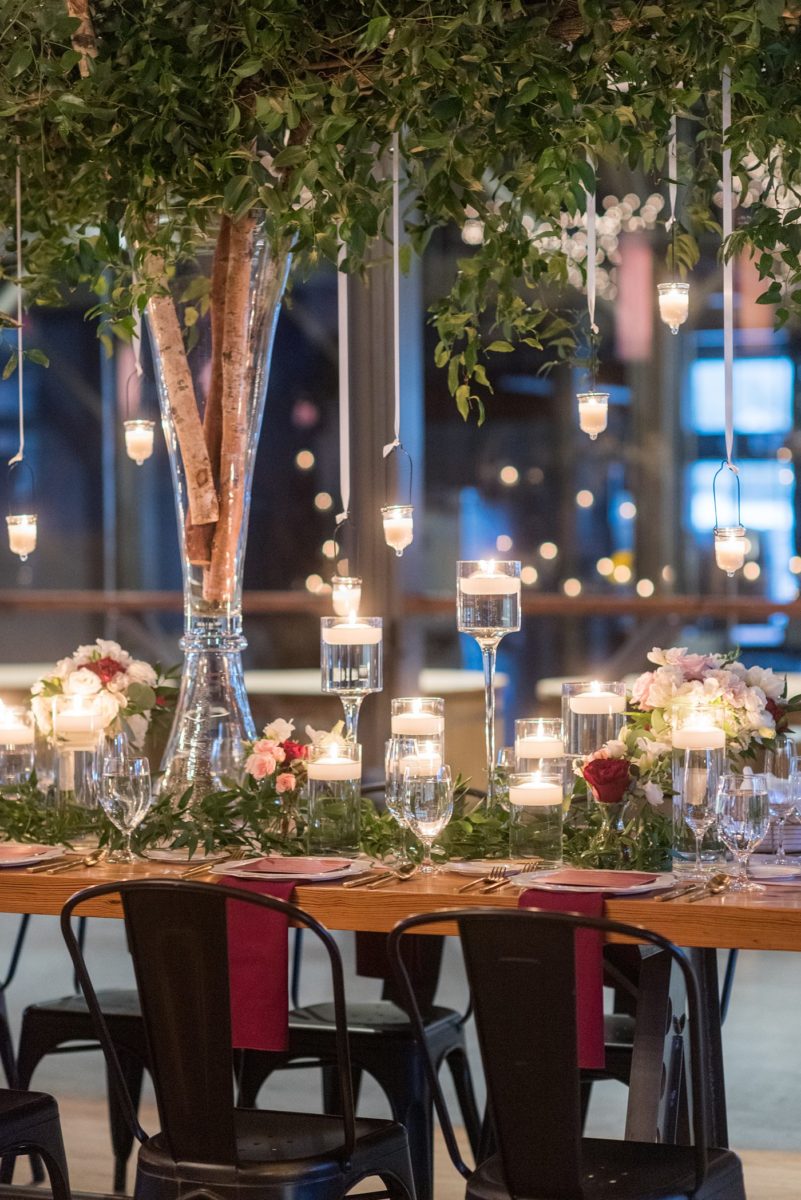 Wedding photographer Mikkel Paige Photography captures a ceremony at Duke Chapel and reception at The Rickhouse, a beautiful downtown Durham, North Carolina. The venue was filled with candlelight and greenery for a maroon and gold color palette wedding. #DukeChapelWedding #DurhamWeddingNorthCarolina #DurhamWeddingPhotographer #MikkelPaige #maroonwedding #fallwedding