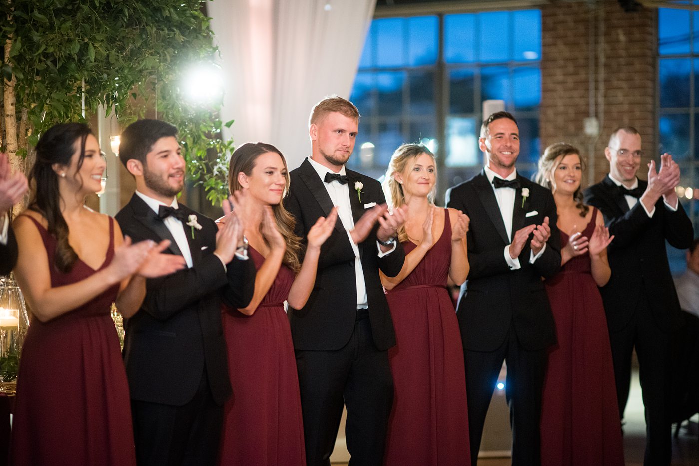 Wedding photographer Mikkel Paige Photography captures a ceremony at Duke Chapel and reception at The Rickhouse, a beautiful downtown Durham, North Carolina. The venue was filled with candlelight and greenery for a maroon and gold color palette wedding. #DukeChapelWedding #DurhamWeddingNorthCarolina #DurhamWeddingPhotographer #MikkelPaige #maroonwedding #fallwedding