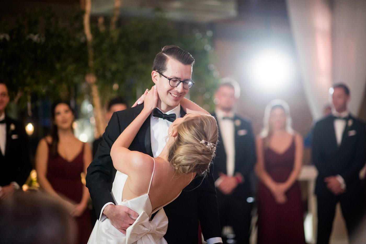 Wedding photographer Mikkel Paige Photography captures a ceremony at Duke Chapel and reception at The Rickhouse, a beautiful downtown Durham, North Carolina. The venue was filled with candlelight and greenery for a maroon and gold color palette wedding. #DukeChapelWedding #DurhamWeddingNorthCarolina #DurhamWeddingPhotographer #MikkelPaige #maroonwedding #fallwedding