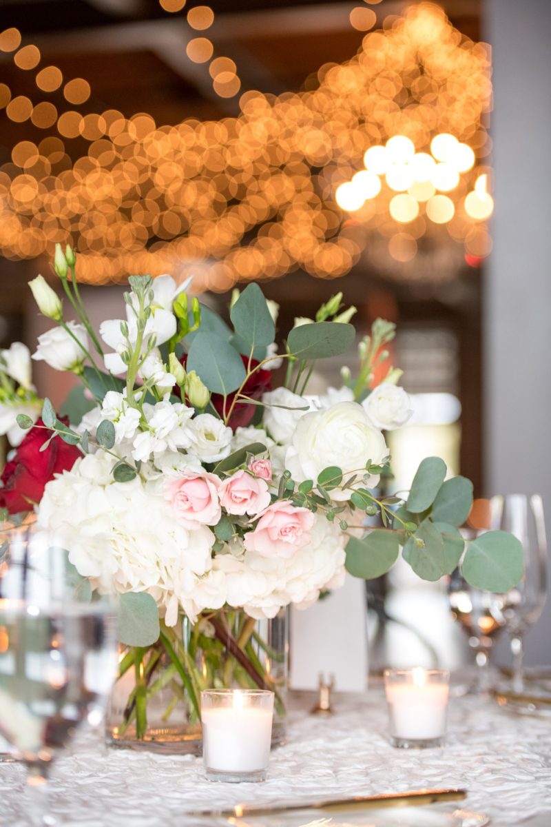 Wedding photographer Mikkel Paige Photography captures a ceremony at Duke Chapel and reception at The Rickhouse, a beautiful downtown Durham, North Carolina. The venue was filled with candlelight and greenery for a maroon and gold color palette wedding. #DukeChapelWedding #DurhamWeddingNorthCarolina #DurhamWeddingPhotographer #MikkelPaige #maroonwedding #fallwedding