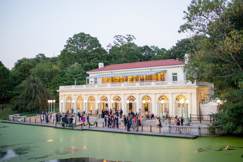Picture of a luxury wedding at Prospect Park Boathouse lake front venue in Brooklyn. This iconic NYC wedding location is the perfect option to impress guests with its beauty and proximity to Manhattan. Images by Mikkel Paige Photography.