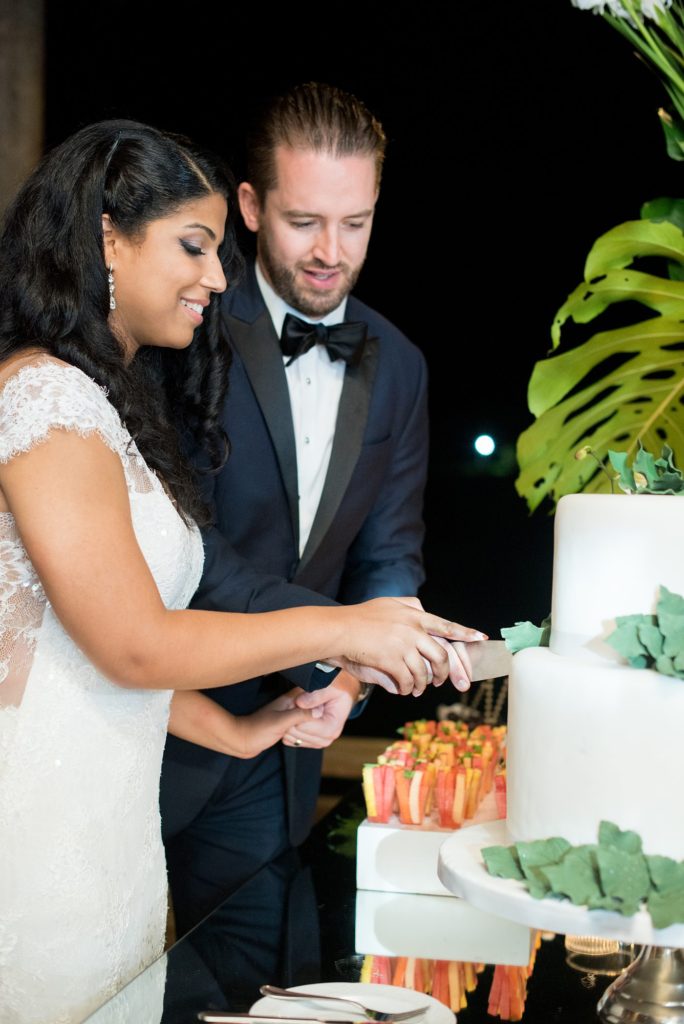 Casa de Campo wedding photos in the Dominican Republic with outdoor ceremony. Pictures of the cake cutting by Mikkel Paige Photography.