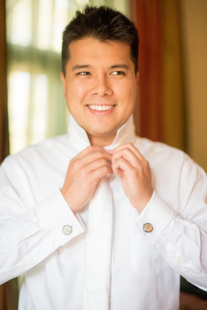 Groom getting ready at a destination wedding at a California winery in Los Gatos called Testarossa. Photos by Mikkel Paige Photography.