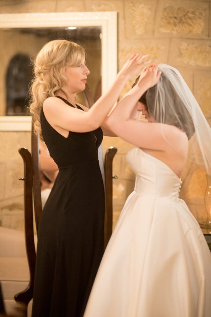 Bride getting her veil on for her destination wedding at a California winery in Los Gatos called Testarossa. Photos by Mikkel Paige Photography.