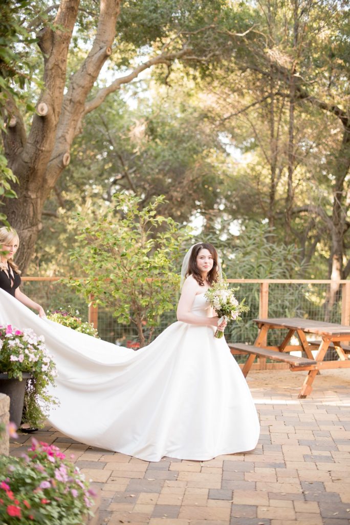 Bride getting ready for her destination wedding first look at a California winery in Los Gatos called Testarossa. Photos by Mikkel Paige Photography.