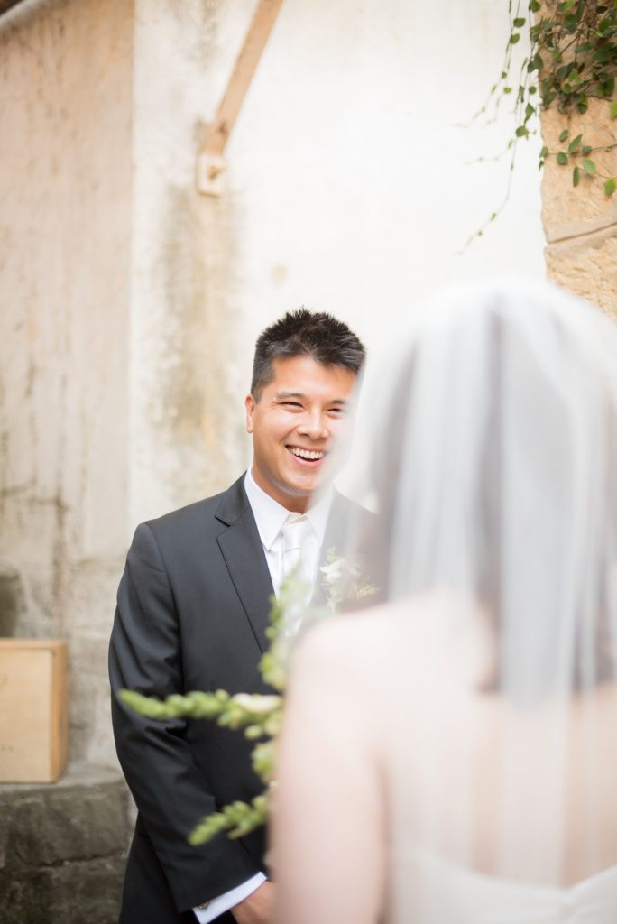 A destination wedding first look with the bride and groom at a California winery in Los Gatos called Testarossa. Photos by Mikkel Paige Photography.