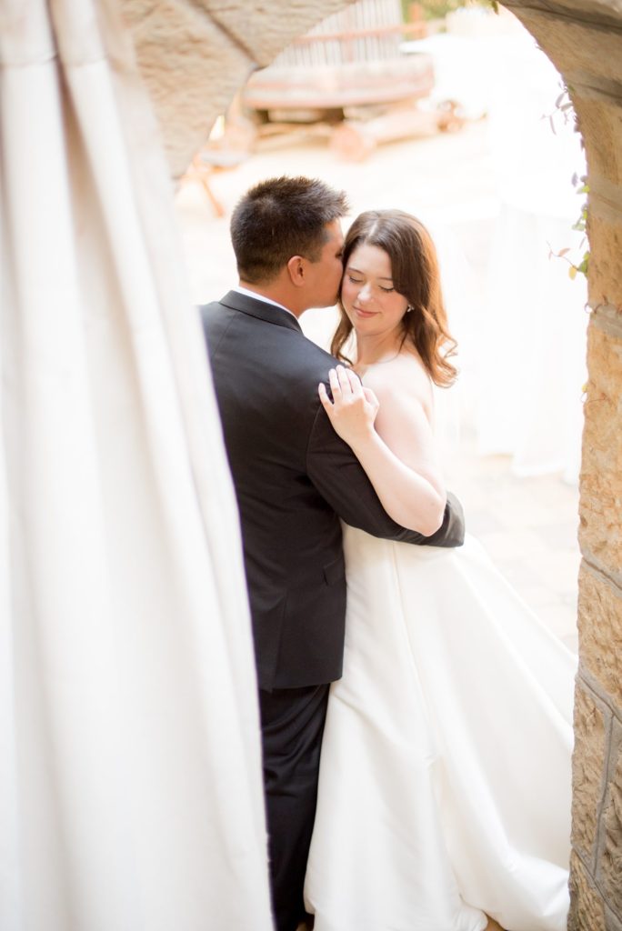A destination wedding picture with the bride and groom at a California winery in Los Gatos called Testarossa. Photos by Mikkel Paige Photography.