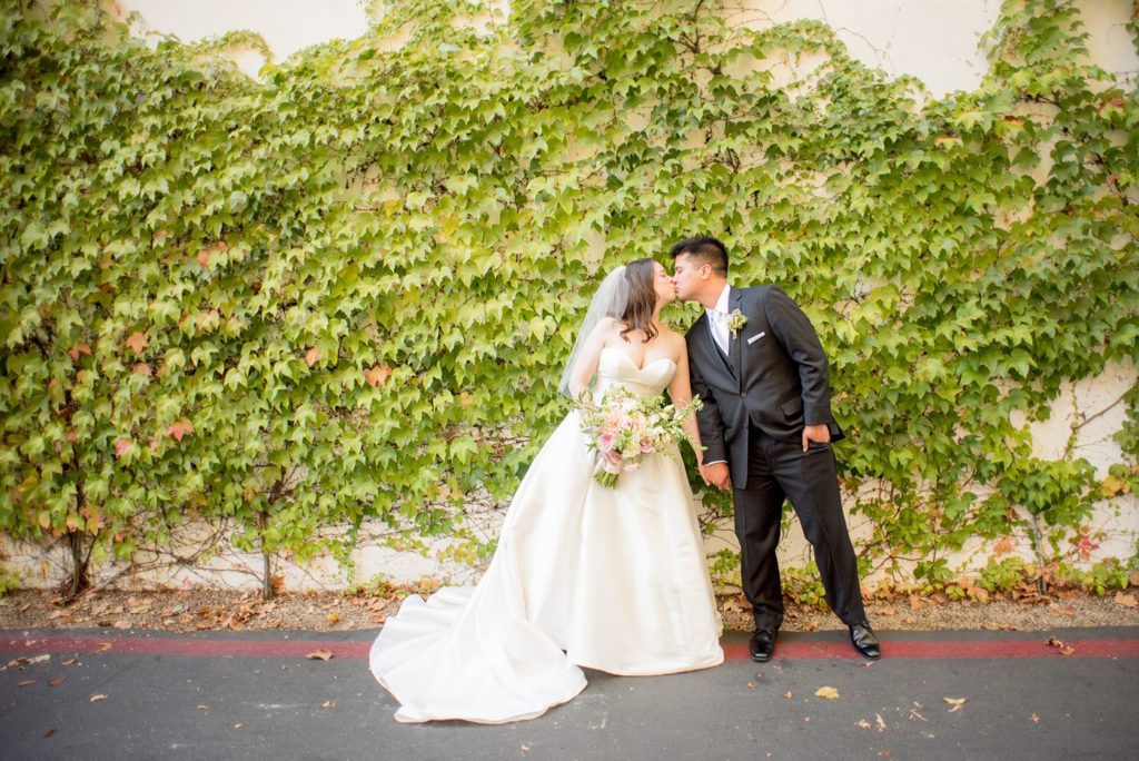 A destination wedding picture with the bride and groom at a California winery in Los Gatos called Testarossa. Photos by Mikkel Paige Photography.