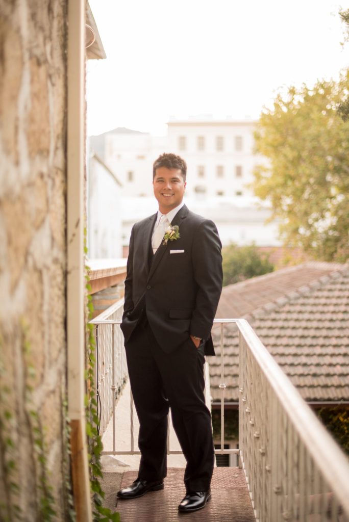 A destination wedding picture with the groom at a California winery in Los Gatos called Testarossa. Photos by Mikkel Paige Photography.