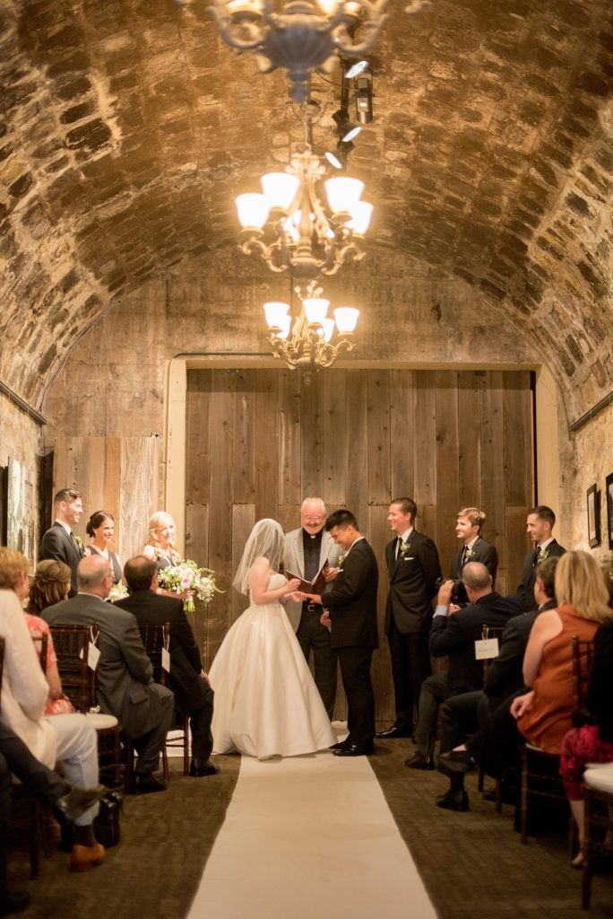 A destination wedding picture of the ceremony at a California winery in Los Gatos called Testarossa. Photos by Mikkel Paige Photography.