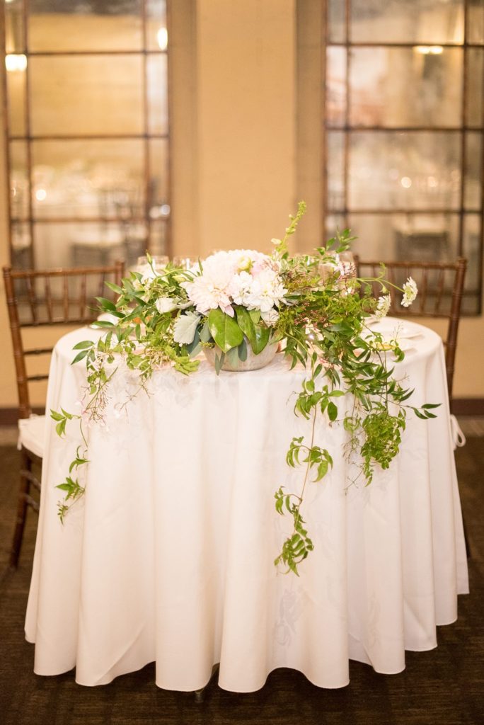 A destination wedding reception with white and pink flowers at a California winery in Los Gatos called Testarossa. Photos by Mikkel Paige Photography.