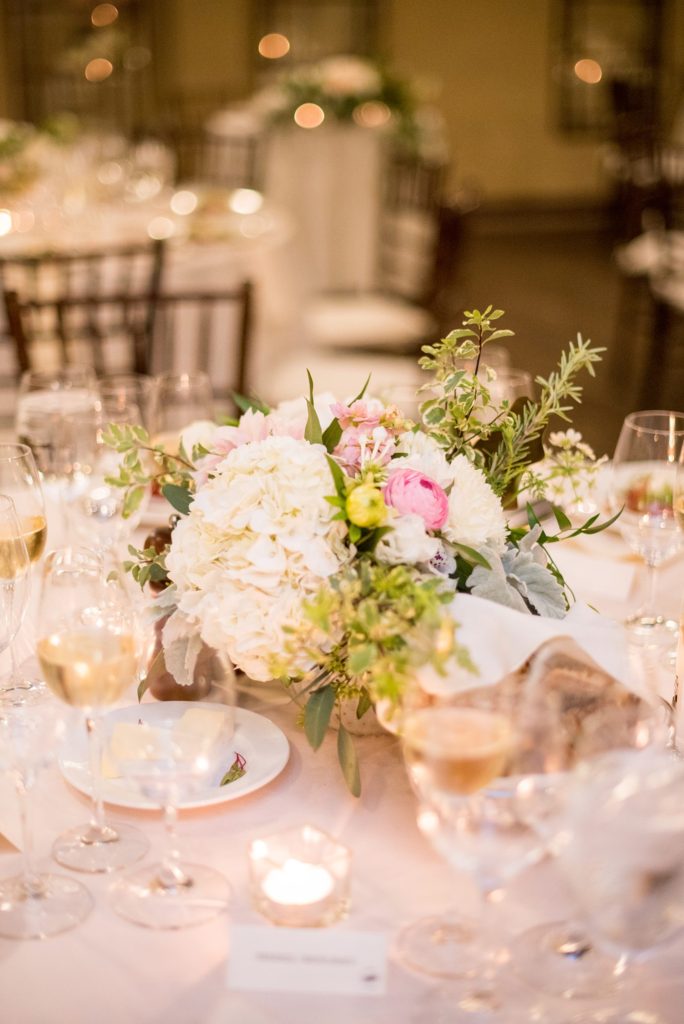 A destination wedding reception with white and pink flowers at a California winery in Los Gatos called Testarossa. Photos by Mikkel Paige Photography.