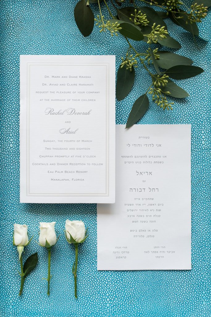 Eau Palm Beach Florida Destination Wedding photos by Mikkel Paige Photography with an invitation with hebrew writing for a Jewish ceremony.