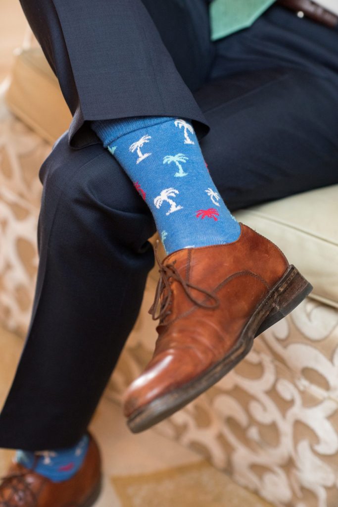 Eau Palm Beach Florida Destination Wedding photos by Mikkel Paige Photography. The groom wore palm tree socks.