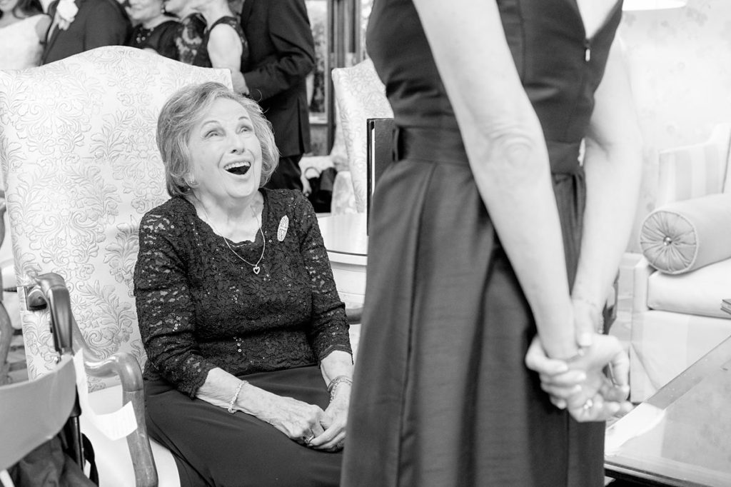 Eau Palm Beach Florida Destination Wedding photos by Mikkel Paige Photography. The grandmother showed elation during the luxurious wedding day.