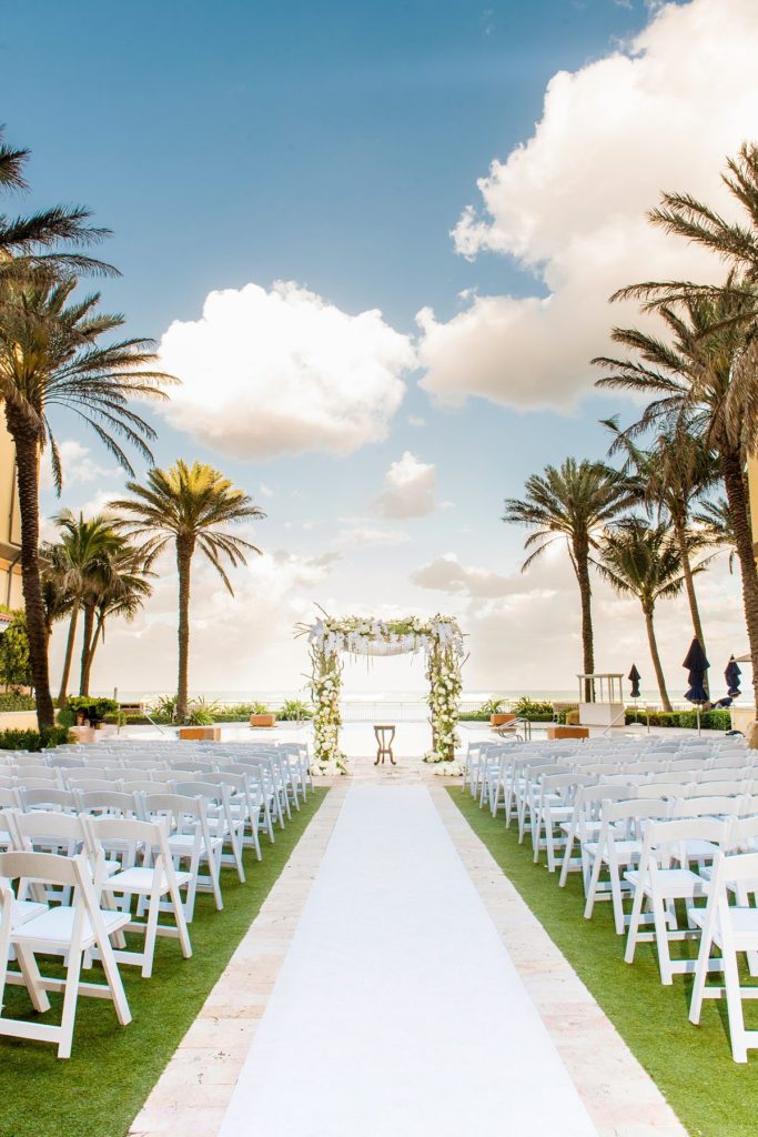 Eau Palm Beach Florida Destination Wedding photos by Mikkel Paige Photography. The Jewish ceremony was held by the pool overlooking the ocean.