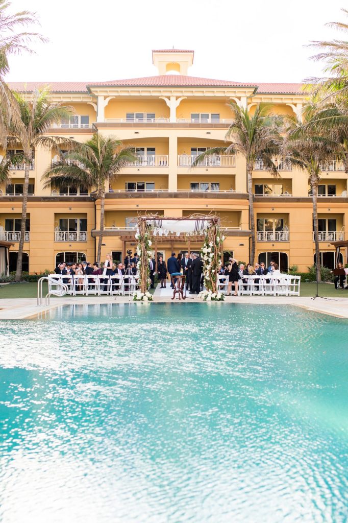 Eau Palm Beach Florida Destination Wedding photos by Mikkel Paige Photography. The Jewish ceremony was held by the pool overlooking the ocean.