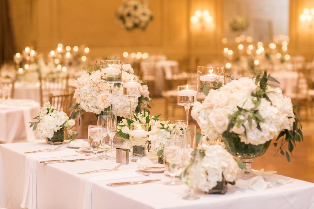 Eau Palm Beach Florida Destination Wedding photos by Mikkel Paige Photography. The luxurious reception was held in the gold ballroom, drenched in white flowers and candlelight.