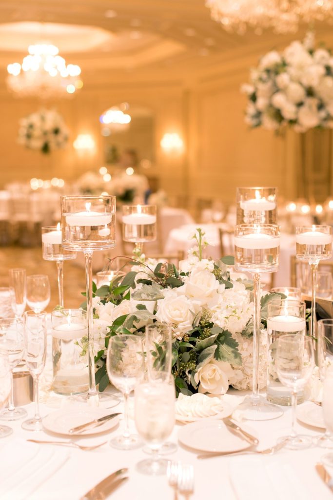 Eau Palm Beach Florida Destination Wedding photos by Mikkel Paige Photography. The luxurious reception was held in the gold ballroom, drenched in white flowers and candlelight.
