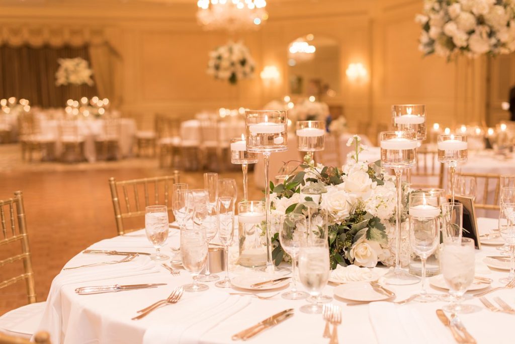 Eau Palm Beach Florida Destination Wedding photos by Mikkel Paige Photography. The luxurious reception was held in the gold ballroom, drenched in white flowers.